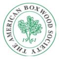 The American Boxwood Society official circular seal logo, correctly aspect-ratio corrected to perfect circle, with curved green wordmark THE AMERICAN BOXWOOD SOCIETY, central boxwood plant illustration, and 1961 founding year on white background